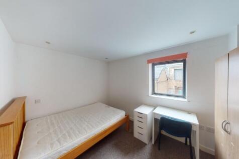 Bright and tidy double bedroom featuring a comf...