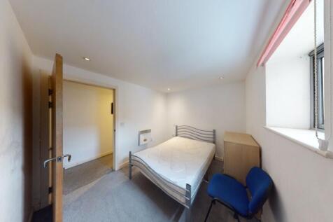 Bright and tidy double bedroom featuring a comf...