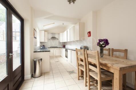 A spacious and inviting kitchen with modern app...