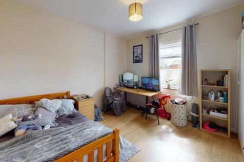 Bright and comfortable master bedroom featuring...