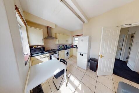 Bright and tidy kitchen with modern appliances ...