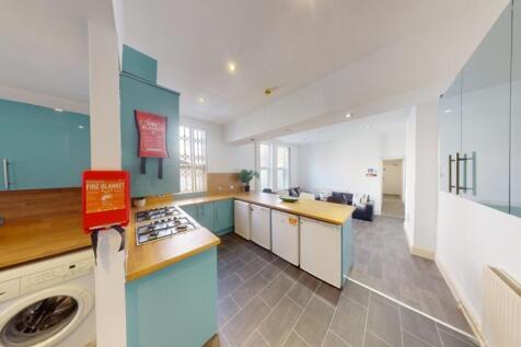 Bright and modern kitchen with ample countertop...