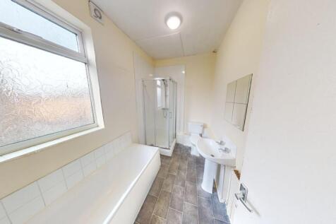 Bright and clean bathroom featuring a full-size...