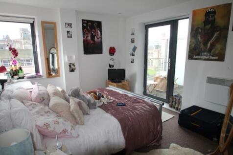 Bright and inviting master bedroom featuring a ...