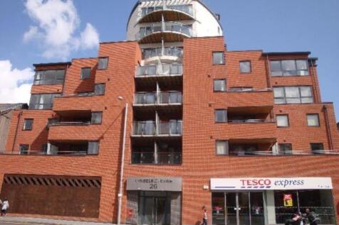 A modern terraced apartment building with well-...