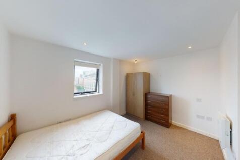 Bright and tidy double bedroom featuring a comf...
