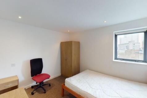 A simple and tidy single bedroom featuring a co...