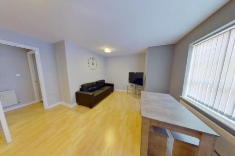 A bright and welcoming living room featuring li...
