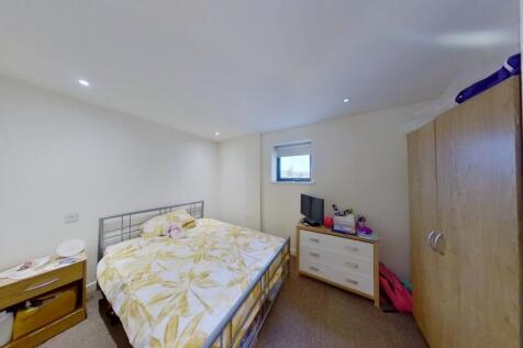 A cozy double bedroom featuring a comfortable d...