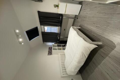 Bright and modern double bedroom featuring a ne...
