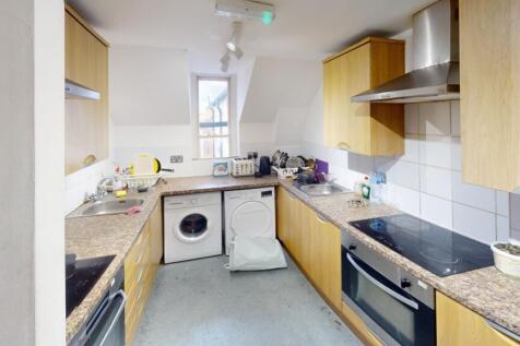 Bright and functional kitchen featuring ample c...