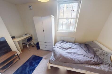 Cozy single bedroom featuring a comfortable sin...