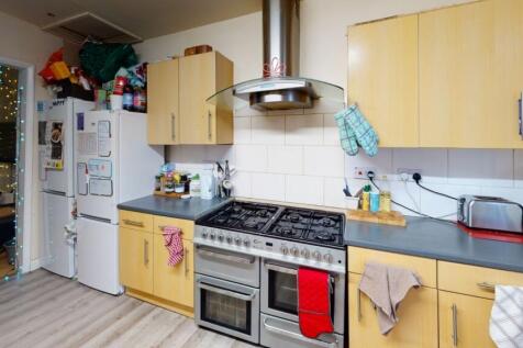 A bright and functional kitchen featuring ample...