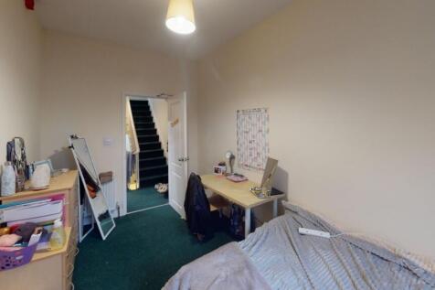 Cozy student room featuring a practical layout ...