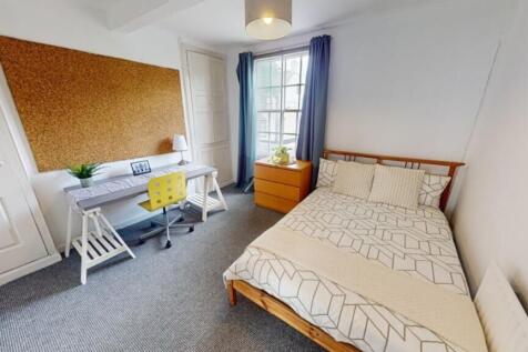 A bright and spacious double bedroom featuring ...