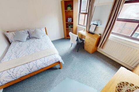 A bright and inviting double bedroom featuring ...
