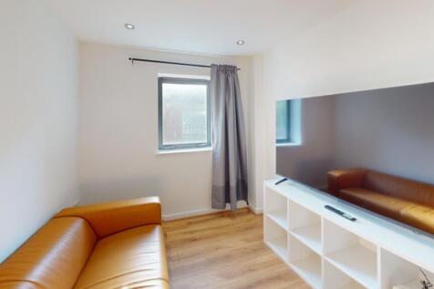 A bright and inviting living room featuring mod...
