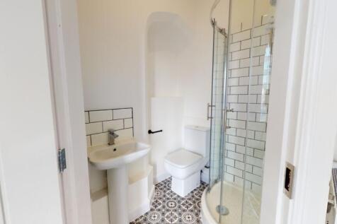 A modern and clean bathroom featuring a stylish...