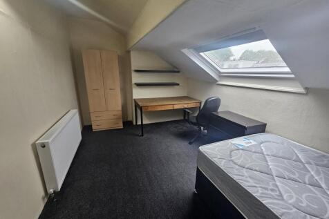 A bright and neatly maintained student bedroom ...