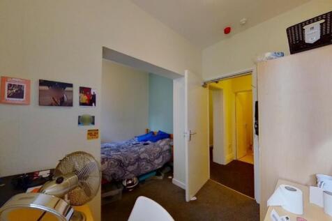Cozy and functional single bedroom featuring a ...