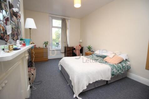 Bright and comfortable master bedroom featuring...