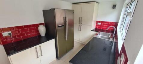 A bright and modern kitchenette featuring sleek...