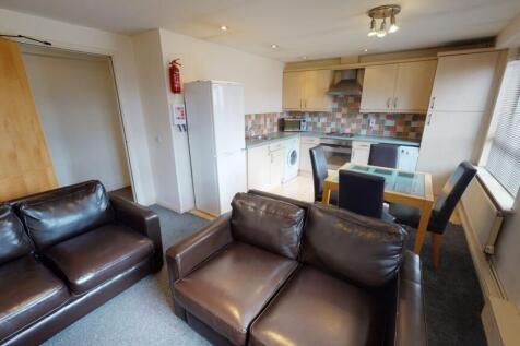 A cozy and practical living room featuring two ...