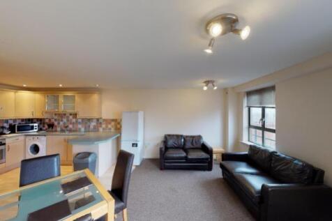 A cozy and well-maintained living room featurin...