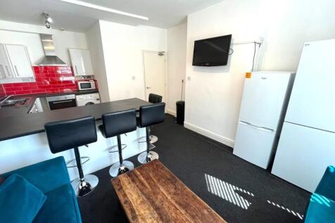 A spacious and modern living room with stylish ...