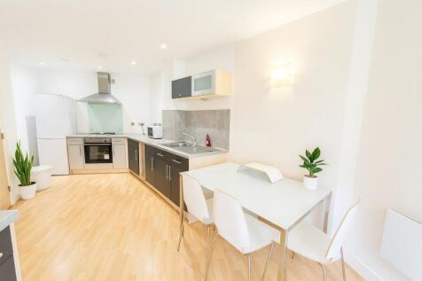 Bright and modern kitchen with ample counter sp...
