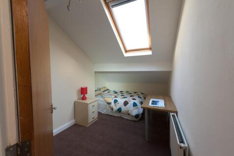 This charming double bedroom features a cozy la...