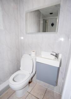 A well-maintained single toilet featuring moder...