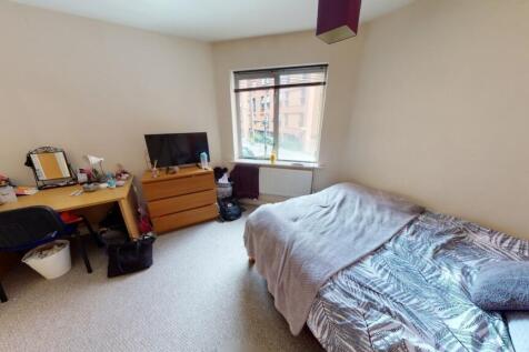 Bright and cozy double bedroom featuring a larg...