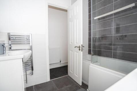 A modern bathroom featuring a sleek design with...