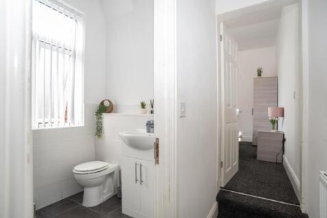 A modern bathroom featuring a sleek design with...