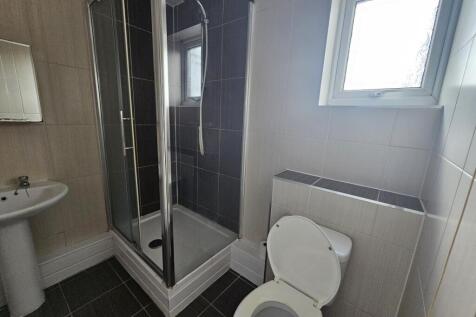 A clean, well-maintained bathroom featuring a s...