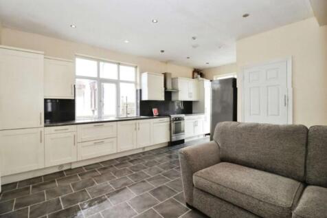 Spacious kitchen featuring modern cabinetry and...