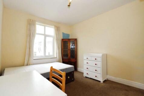 Bright and spacious double bedroom featuring la...