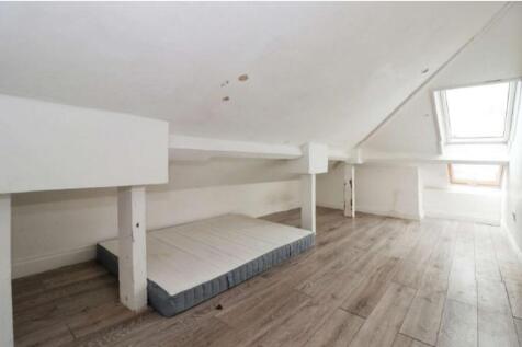Spacious double bedroom featuring a cozy setup ...