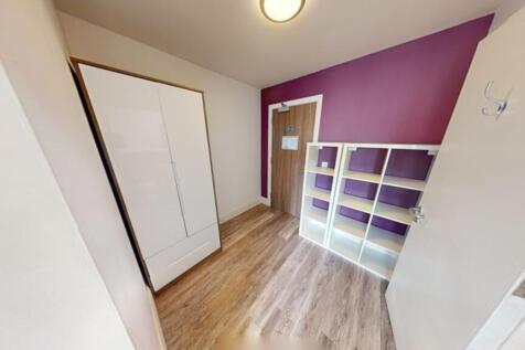 This cozy double bedroom features a vibrant acc...