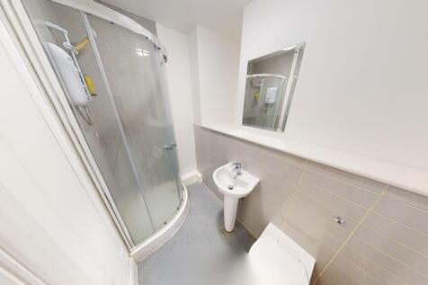 Bright and modern bathroom featuring a sleek sh...