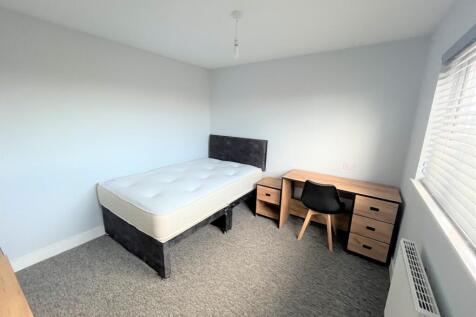 A tidy and bright double bedroom with a modern ...