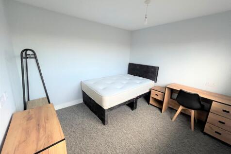 A spacious and inviting double bedroom, perfect...