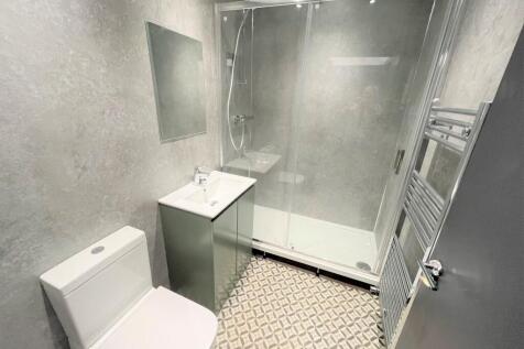 A modern and stylish bathroom featuring a sleek...