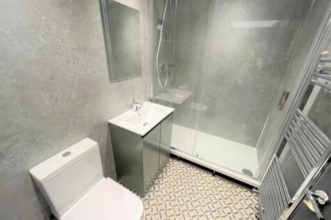 A modern and stylish bathroom featuring a sleek...