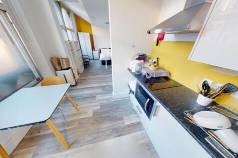 Bright and modern kitchen featuring sleek count...