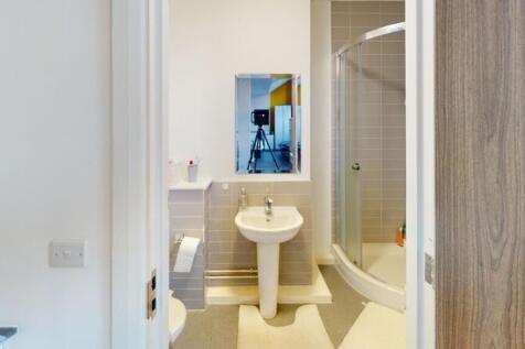 A modern bathroom featuring a sleek shower, sty...