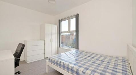 A bright and inviting double bedroom featuring ...