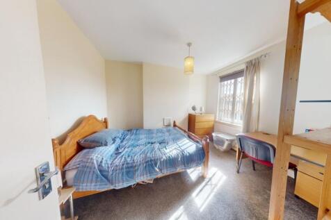 Bright and spacious master bedroom featuring a ...