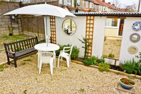 A charming garden space featuring a round table...